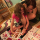 Our 7-year-old tester reading instructions with her mom.